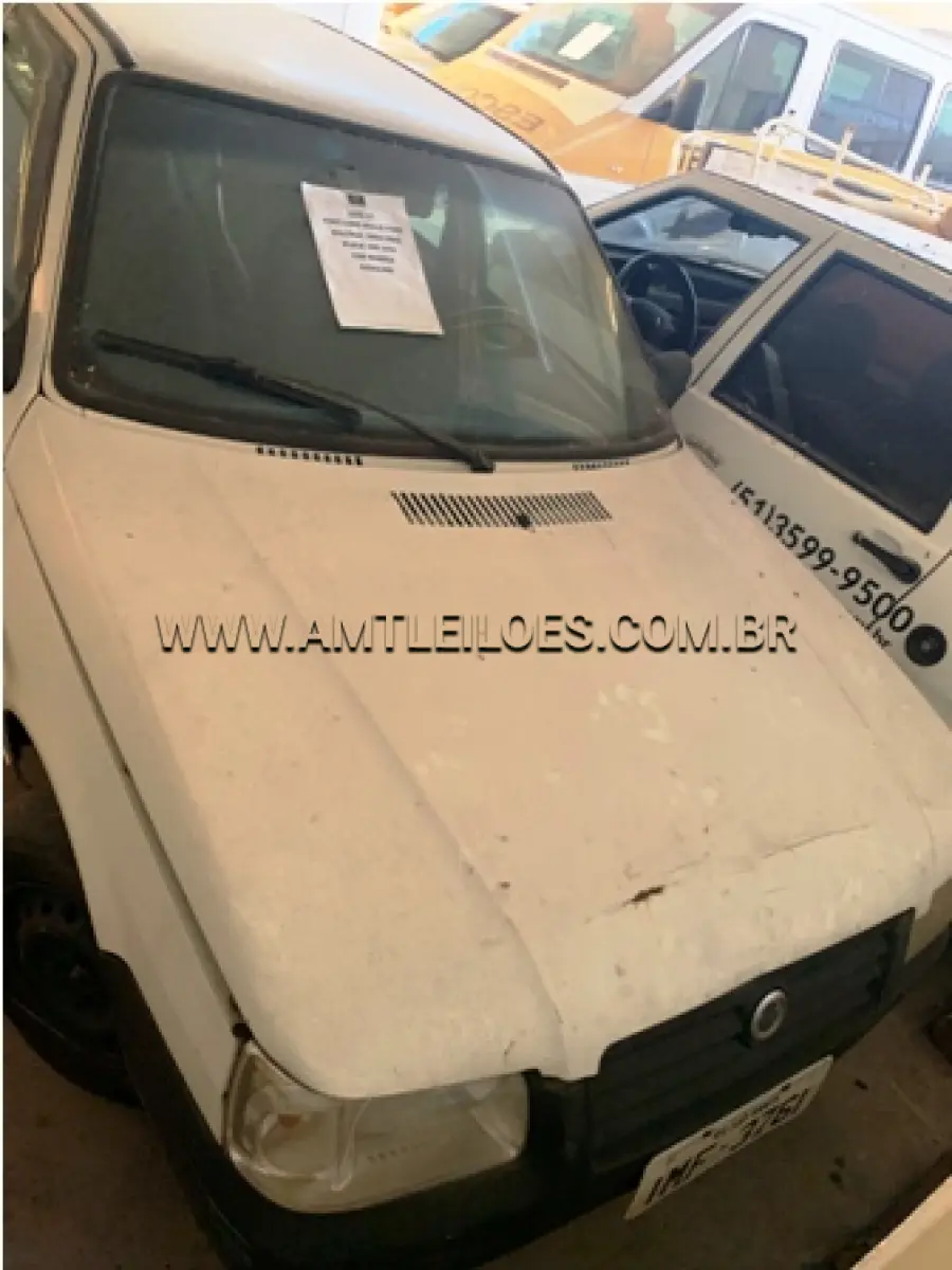 LOTE 017 - MARCA/MODELO: FIAT/UNO MILLE FIRE PLACA: IMF 3761 FABRICAÇÃO/MODELO: 2004/2005 RENAVAM: 843789697 COR: BRANCA COMBUSTÍVEL: GASOLINA